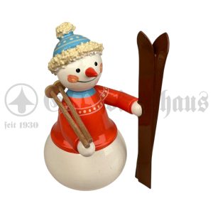 Schneemann mit Ski und Stöcken